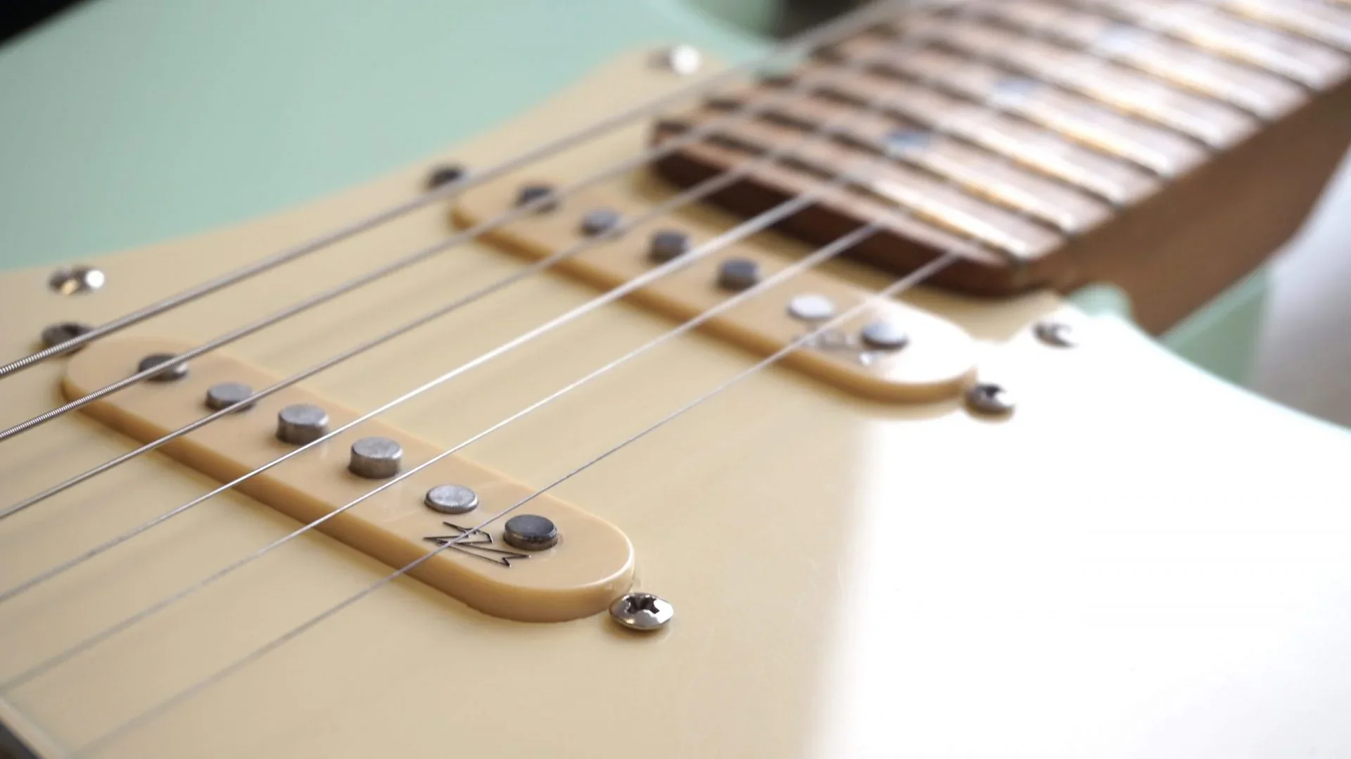 Close-up of a Guitar Anatomy S-style guitar on a workshop bench