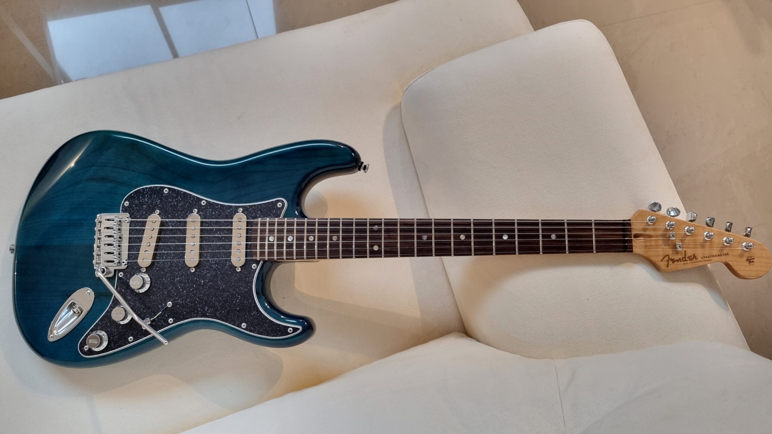 Christophe's Strat built using a GA Transparent blue body & GA Rosewood & roasted flame maple neck. Great build!
