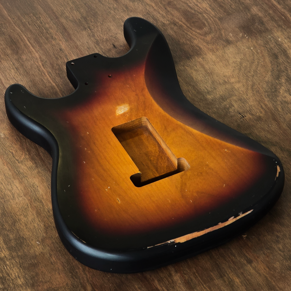 Rear view of a Stratocaster-compatible Sunburst nitro guitar body made from 2-piece alder with stronger Classic ageing.