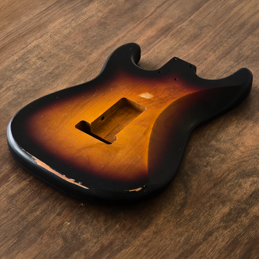Rear view of a Stratocaster-compatible Sunburst nitro guitar body made from 2-piece alder with stronger Classic ageing.