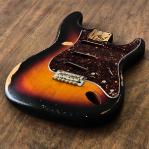 2-piece alder S-style guitar body finished in Sunburst nitro with hand-aged played-in character.