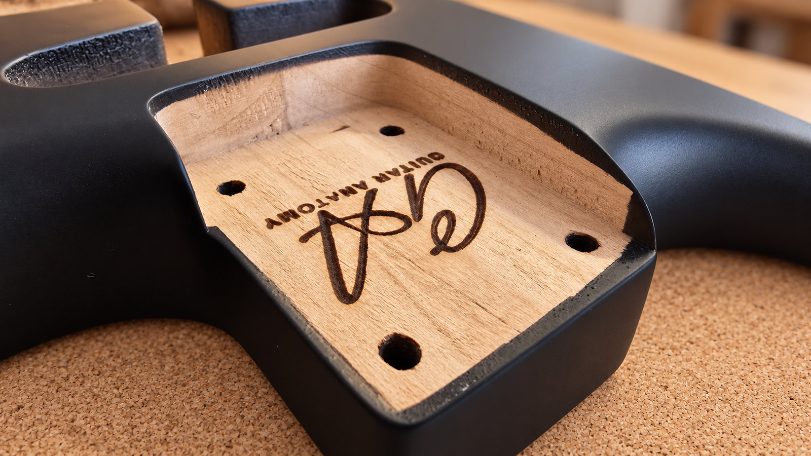 Close-up of a guitar body neck pocket