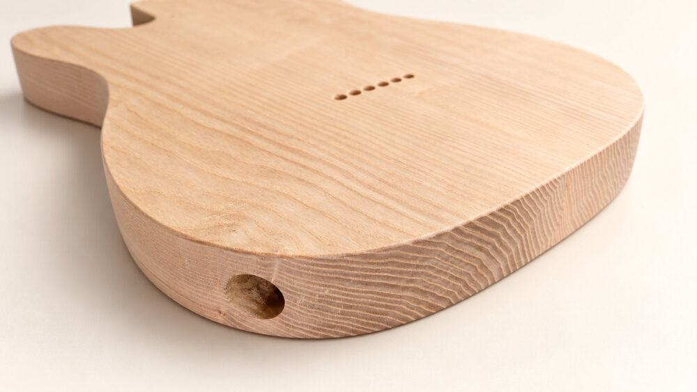 Close-up of guitar body contours and shaping