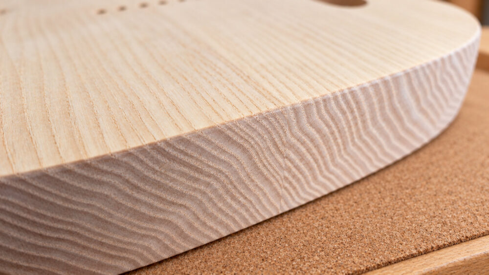 Close-up of guitar body timber and edge construction