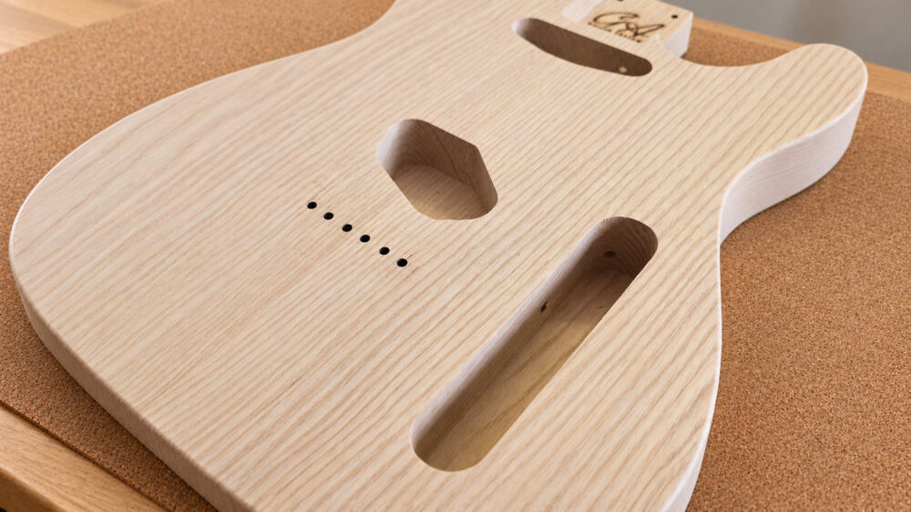Close-up of guitar body pickup and control routing